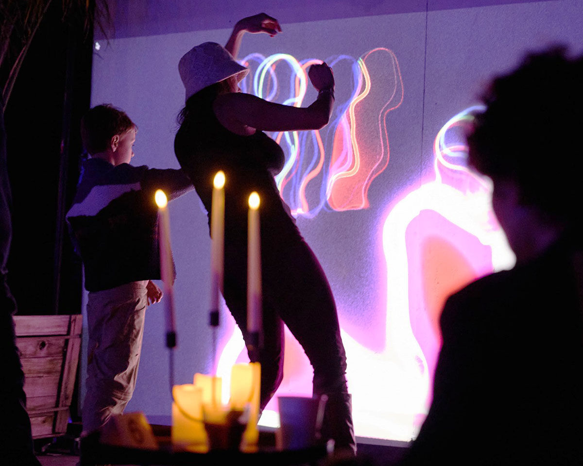Neon Sprawl — interactive projected installation with body tracking